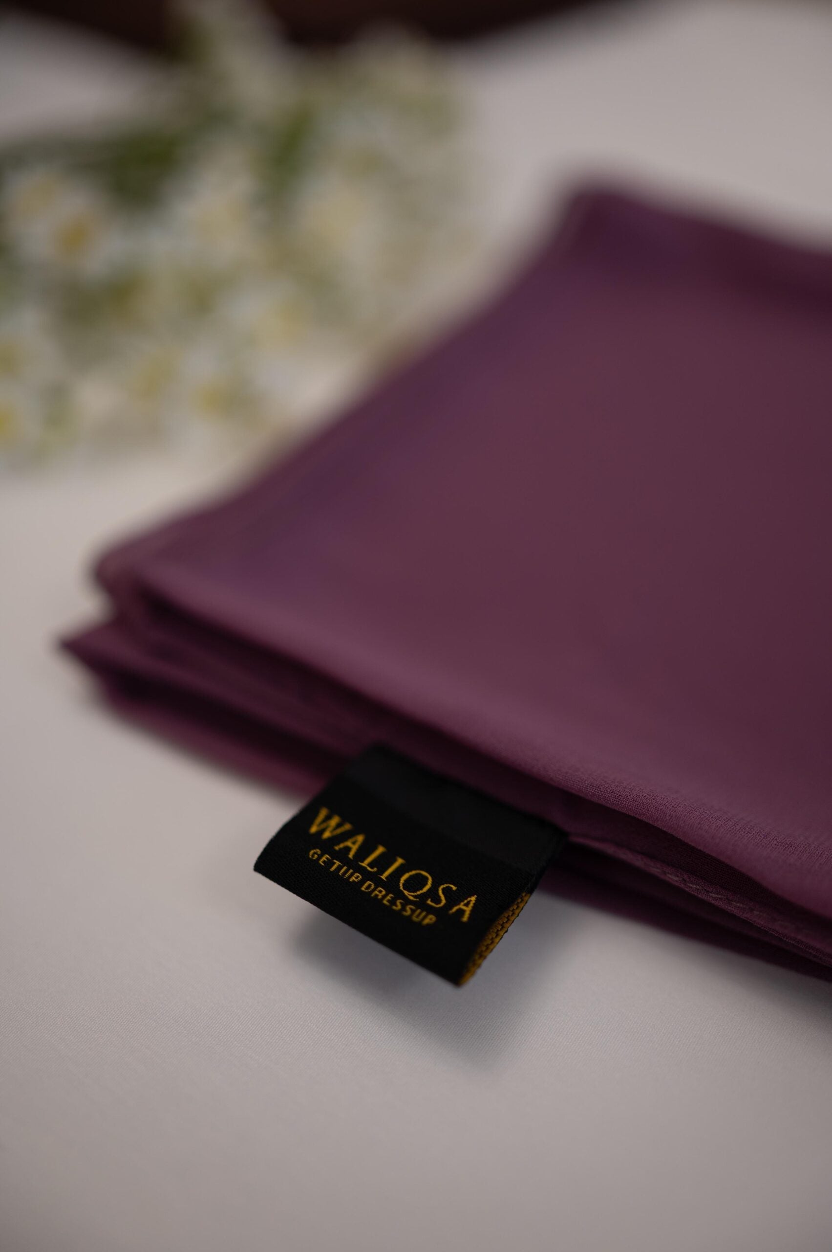 Light lavender chiffon hijab neatly folded with soft breathable texture.