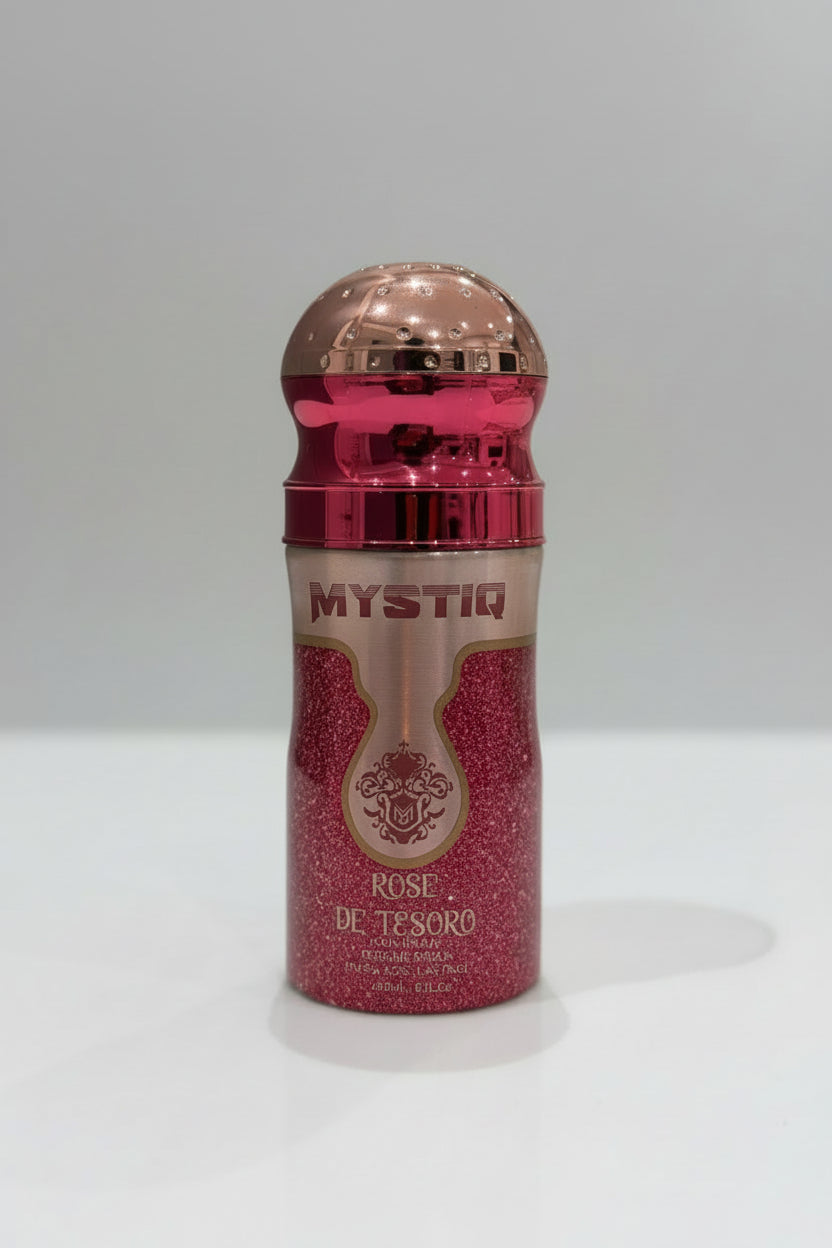 Pink glittery bottle with 'Mystiq' branding on a white surface.