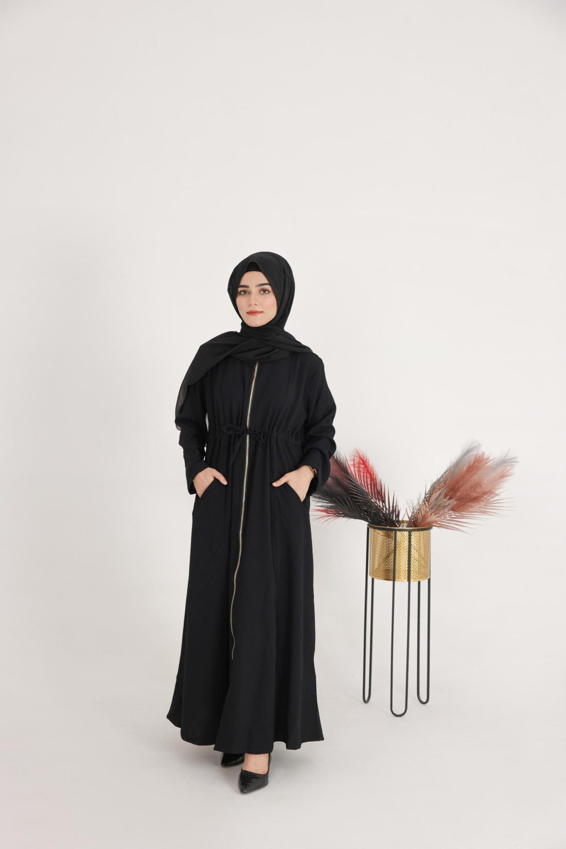 Back view of Hayat abaya showing premium fabric shine

