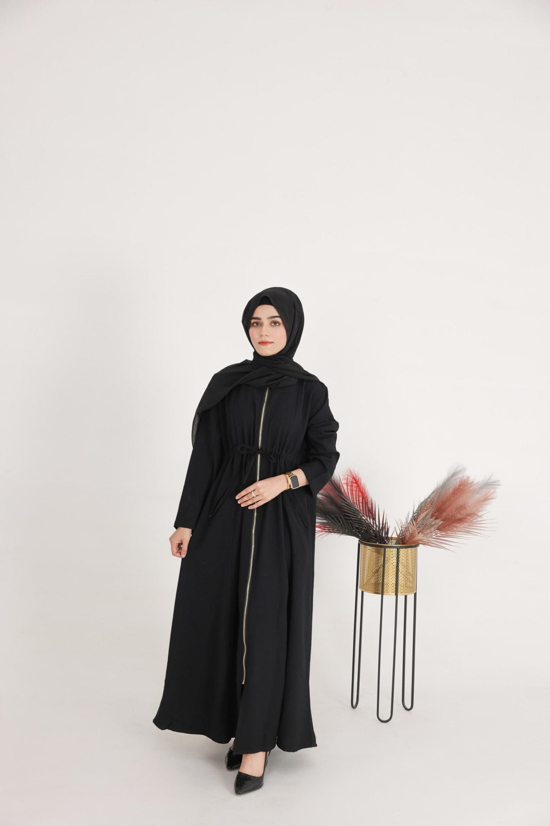 Back view of Hayat abaya showing premium fabric shine

